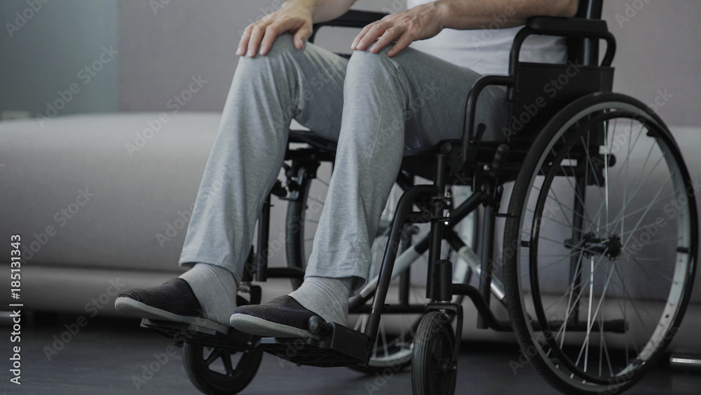 Sorrowful lonely old man sitting in wheelchair and thinking about life, health Sorrowful lonely old man sitting in wheelchair and thinking about life, health