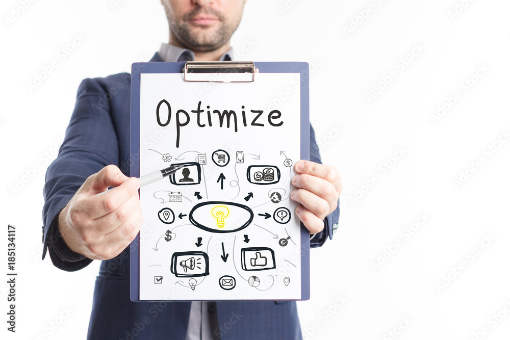 The concept of business, technology, the Internet and the network. A young businessman shows a successful scheme of work: Optimize The concept of business, technology, the Internet and the network. A young businessman shows a successful scheme of work: Optimize