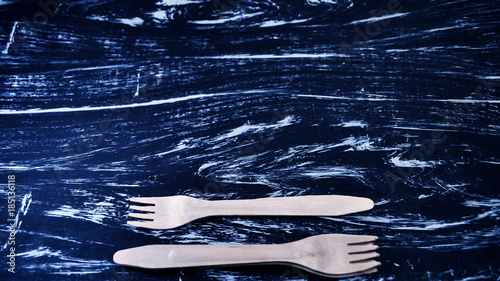 Silver fork lying on a wooden table. Cutlery for eating. Device  photo