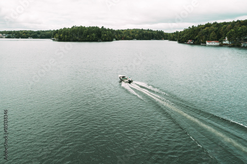 High angle view of motorboat on Lake Rosseau against sky photo