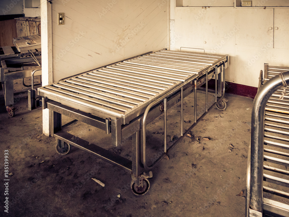 Hospital bed at abandoned asylum Hospital bed at abandoned asylum