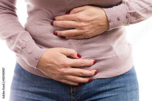 Woman holding her tummy as painful abdomen problem