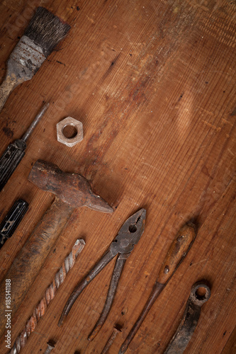 Collection of vintage tools on wooden background