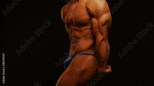 bodybuilder posing in studio