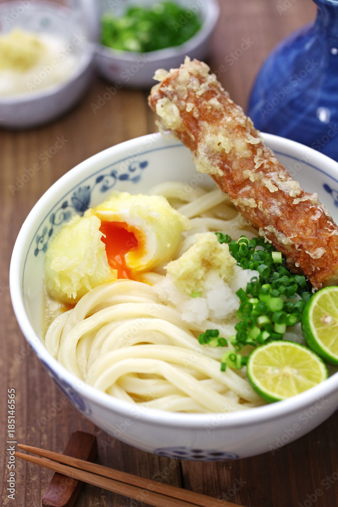 japanese cold Sanuki udon noodles on toppings with surimi tempura and
