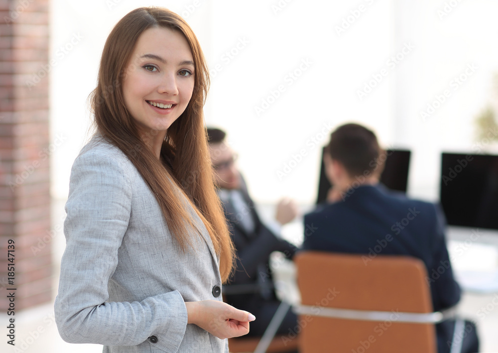 smiling employee on the background of the office.