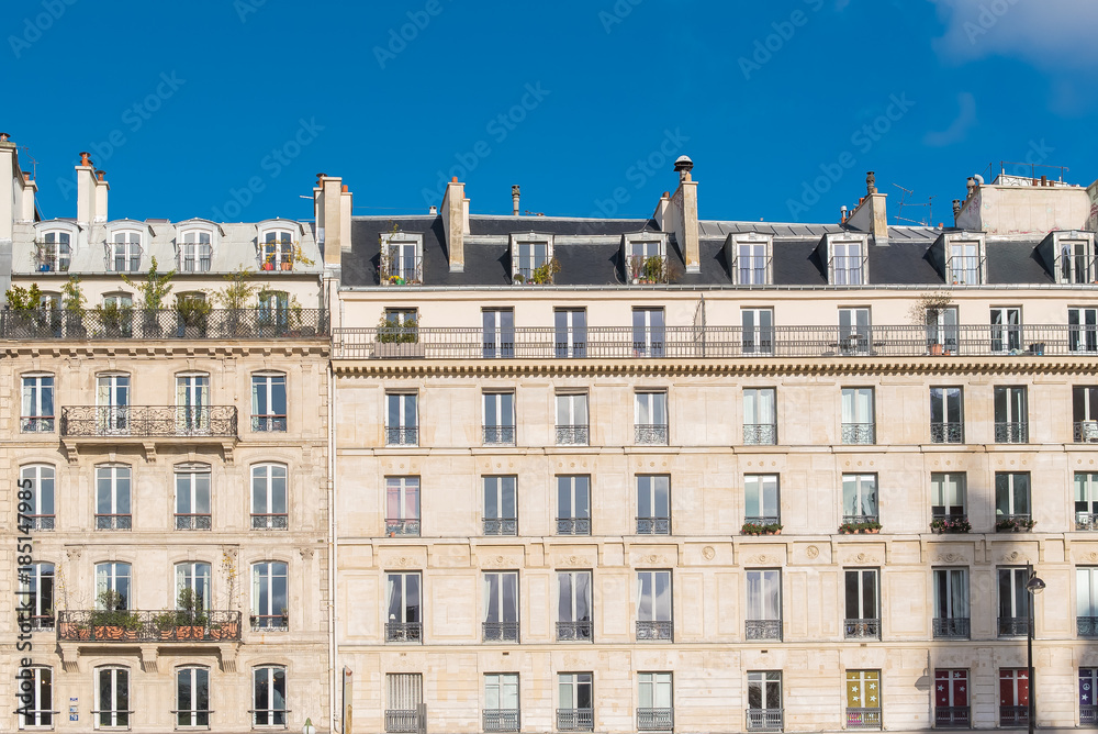 Paris, beautiful building facade in a attractive area of the capital, in the Marais
