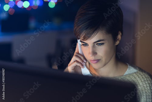 Woman talking on the phone late at night