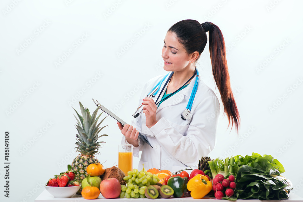 Female dietitian in uniform with stethoscope Female dietitian in uniform with stethoscope