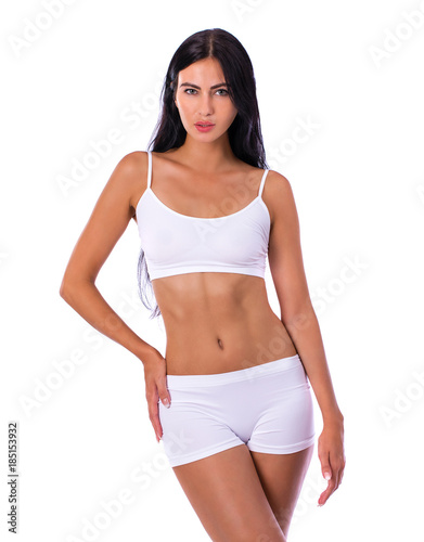 Sexy woman in white fitness clothing