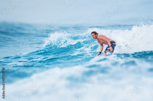 Surfer rides the wave in the ocean