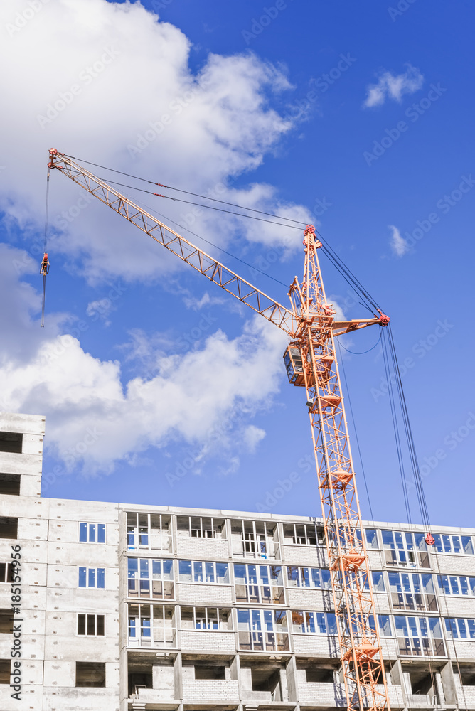 Crane is used in the construction of buildings.