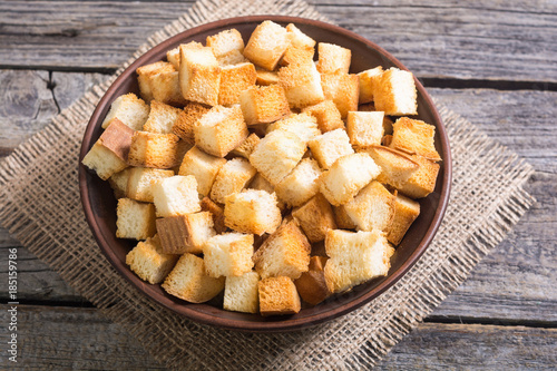 Crispy croutons in bowl photo
