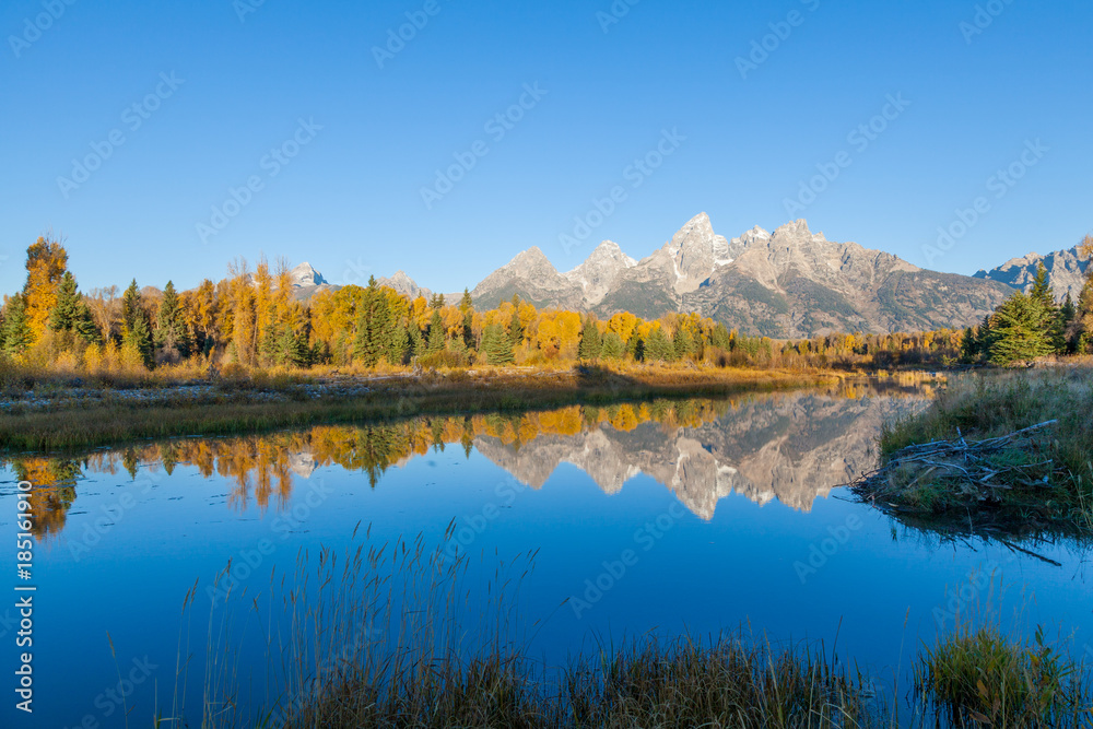 Scenic Autumn Reflection in the Tetons at Sunrise Scenic Autumn Reflection in the Tetons at Sunrise