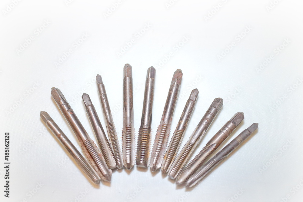 Tool for threading in holes and stilettos on a white background Tool for threading in holes and stilettos on a white background
