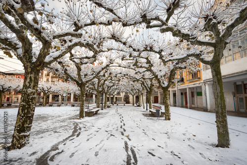 Winter scene of a snowed cityscape landscape of the ancient village of Briviesca in Burgos Province, Castilla y Leon, Spain. © herraez