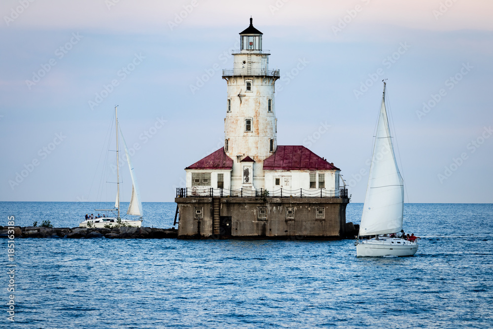 Lighthouse with sailboats