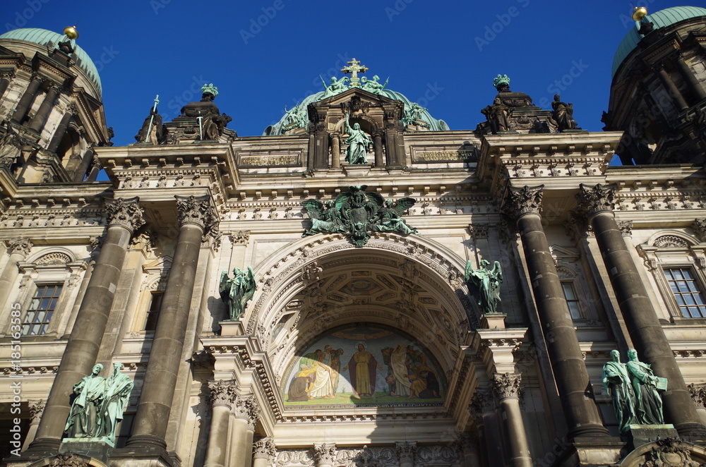 Berliner Dom - cathedral in Berlin. Rich decorations and decorative sculptures of the facade of one of the most famous churches in Germany, the historic cathedral standing on the Museum Island.