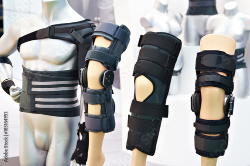 Brace on knee joint with sleeve made of neoprene in store photo