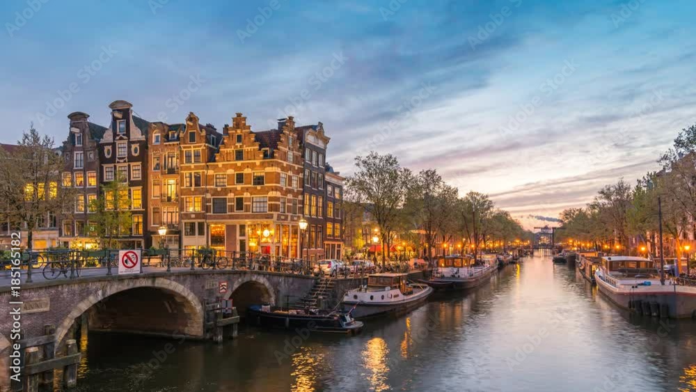 Amsterdam city skyline day to night timelapse at canal waterfront, Amsterdam, Netherlands 4K Time Lapse