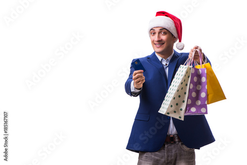 Young man with bags after christmas shopping on white background