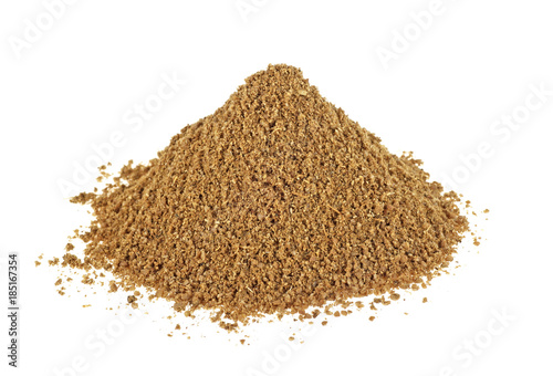 Pile of ground coriander on white background, indian spice