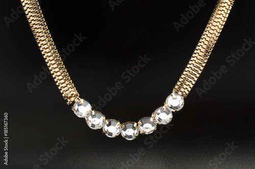 gold necklace with diamonds isolated on black