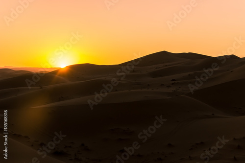 desert sand dune with sunrise in morning