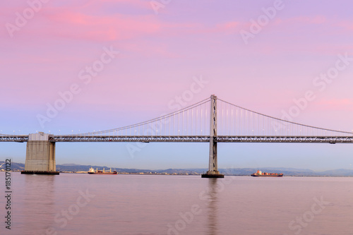 San Francisco-Oakland Bay Bridge in Winter's Twilight. Pier 7, San Francisco, California, USA.