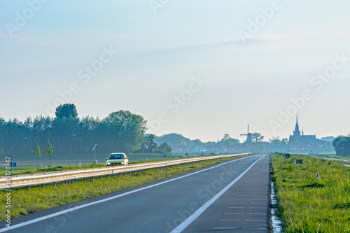Netherlands landscape with windmill and road
