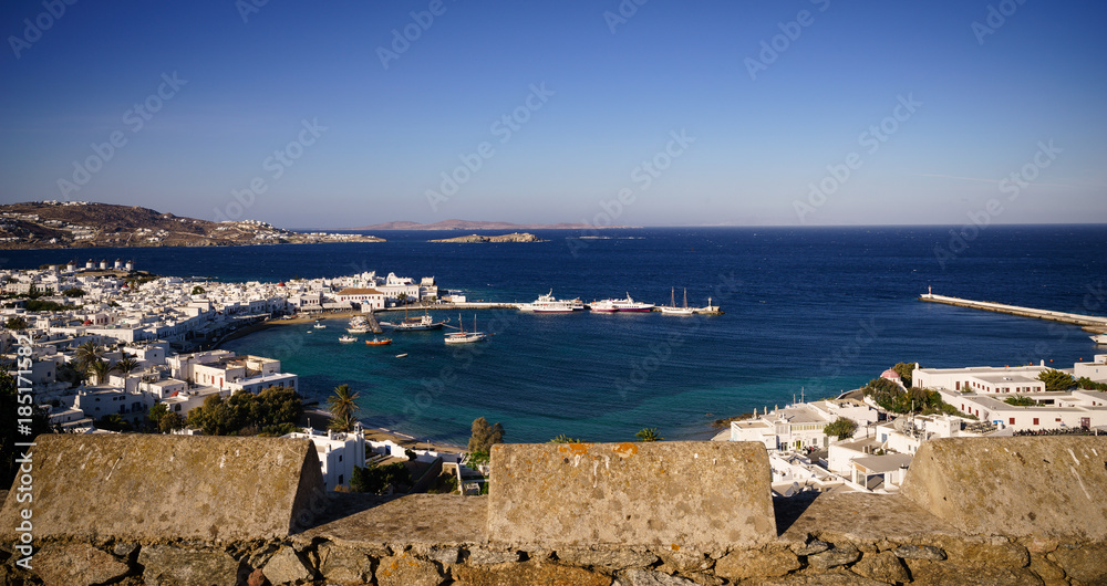 Mykonos island aerial panoramic view at sunset. Mykonos is a island, part of the Cyclades in Greece with old architecture one the foreground