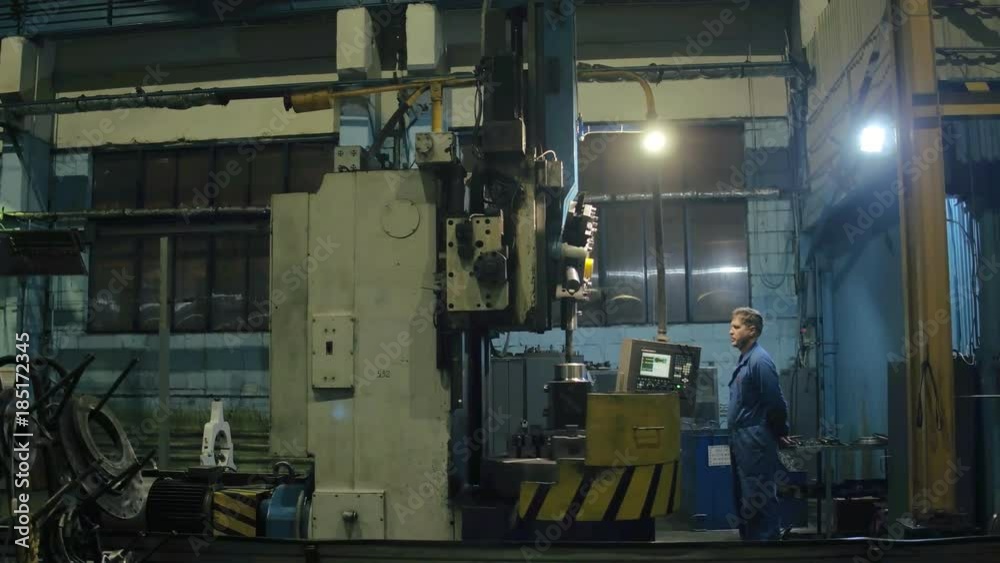 Factory engineer making quality control on modern equipment finished metal parts Factory engineer making quality control on modern equipment finished metal parts