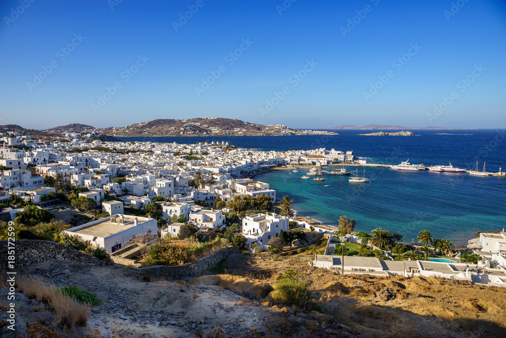 Mykonos island aerial panoramic view at sunny day. Mykonos is a island, part of the Cyclades in Greece with old architecture one the foreground