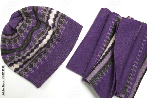 Knitted purple hat and scarf isolated on white background