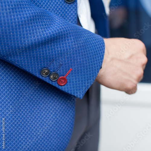 Slika na platnu Three stylish buttons on sleeve of blue jacket