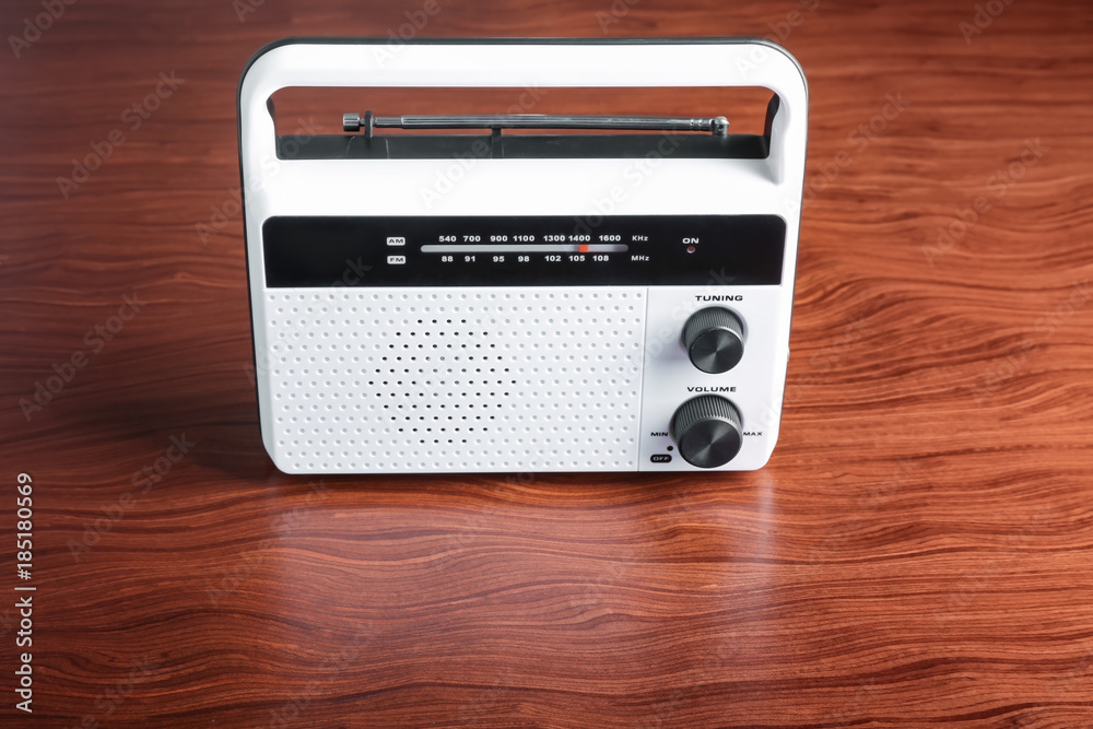 Fototapeta premium Modern radio on wooden background