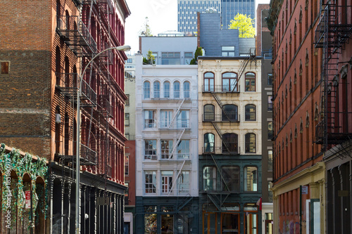 Historic buildings at the intersection of Crosby and Howard Street in the SOHO neighborhood of Manhattan, New York City NYC