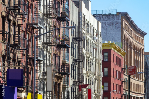 New York City style apartment buildings along Mott Street in the Chinatown neighborhood of Manhattan NYC