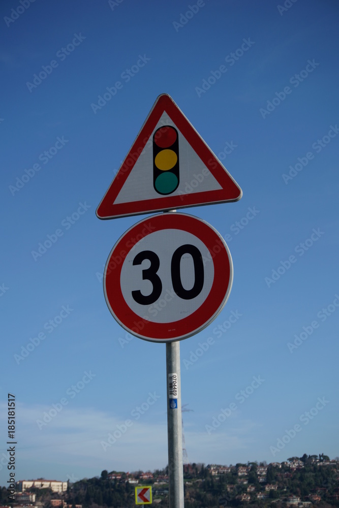 Traffic lights and 30 speed limit signs