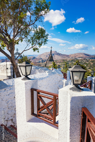 Iron gate and bronze bell in Tsambika Monastery, (RHODES, GREECE) photo