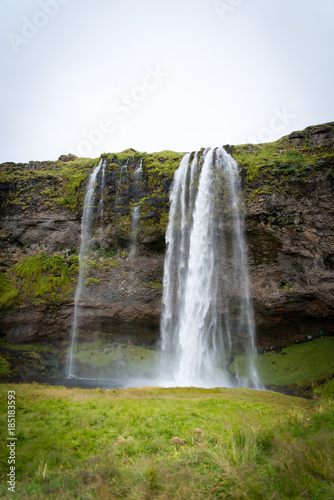 A tall  popular waterfall in iceland. 