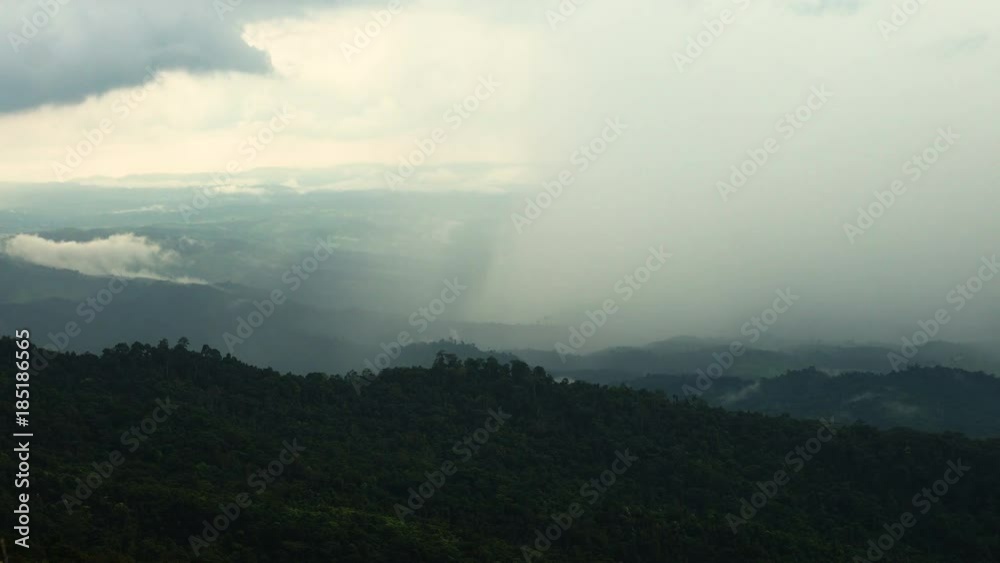 The rain cloud raining over the tropical mountain at Phu Hin Rong Kla National Park , Thailand The rain cloud raining over the tropical mountain at Phu Hin Rong Kla National Park , Thailand