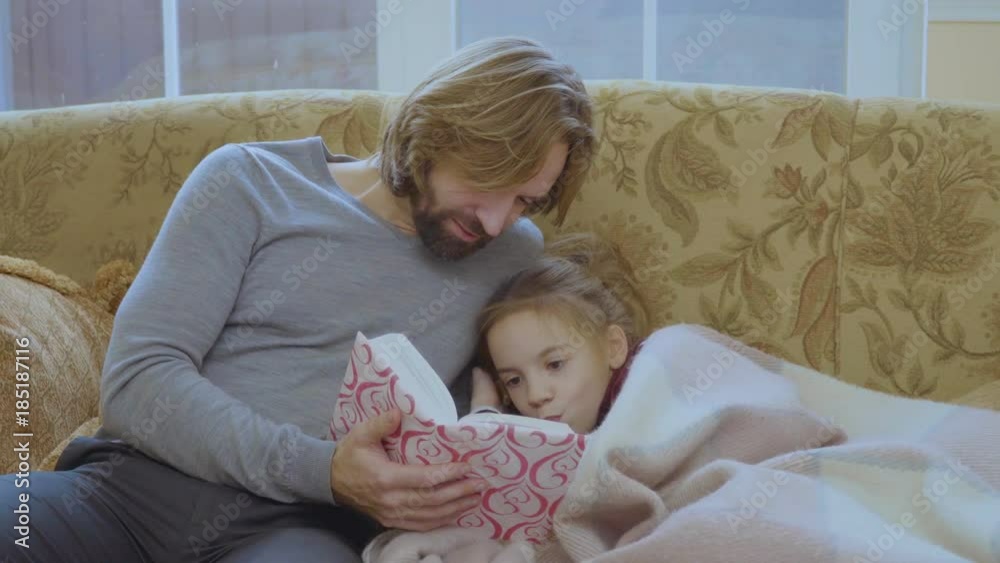 Father read the book a little daughter Father read the book a little daughter