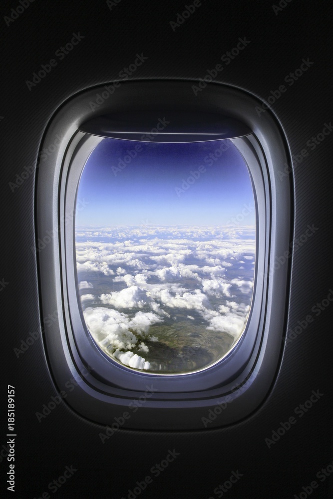 Window view from passenger seat on airplane Window view from passenger seat on airplane