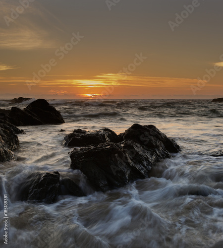 Yellow sunrise with moving water