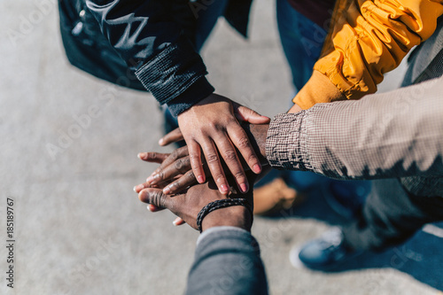 Group of friends stacking hands