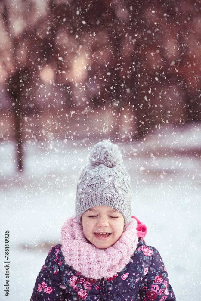 Little girl enjoying snowfall Little girl enjoying snowfall
