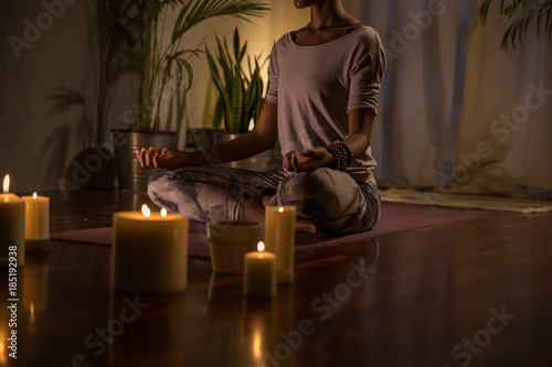 Woman peacefully meditating on a summer evening