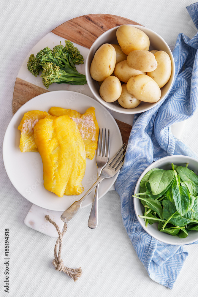 Ingredients for making a healthy smoked haddock dish. Ingredients for making a healthy smoked haddock dish.