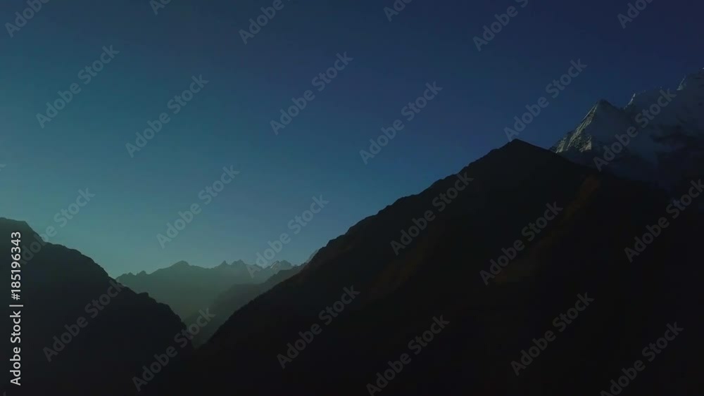 Sunrise above peak in the Himalaya range, Nepal Sunrise above peak in the Himalaya range, Nepal